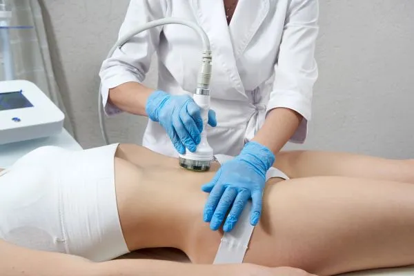 Lost the Weight but Not the Loose Skin? 2 woman having HIFU treatment on her stomach to combat loose skin Thrapston following weight loss